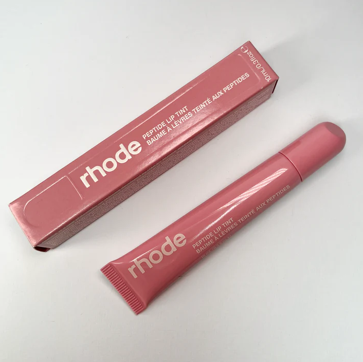 Rhode Peptide Lip Tint providing hydration, nourishment, and a plump, glossy finish with a sheer, buildable formula for soft, smooth lips.