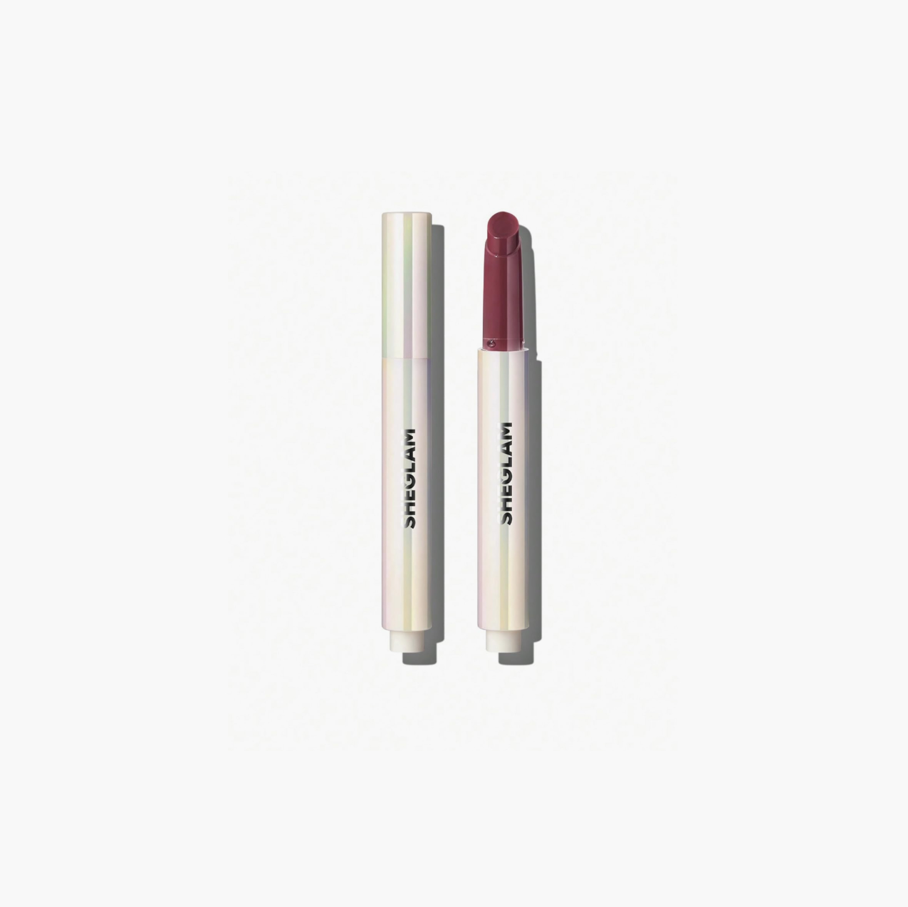 Sheglam Lip Plumper Pout-Perfect Shine offering glossy, plump lips with rich color payoff and hydration from coconut and grape seed oil for smooth comfort.