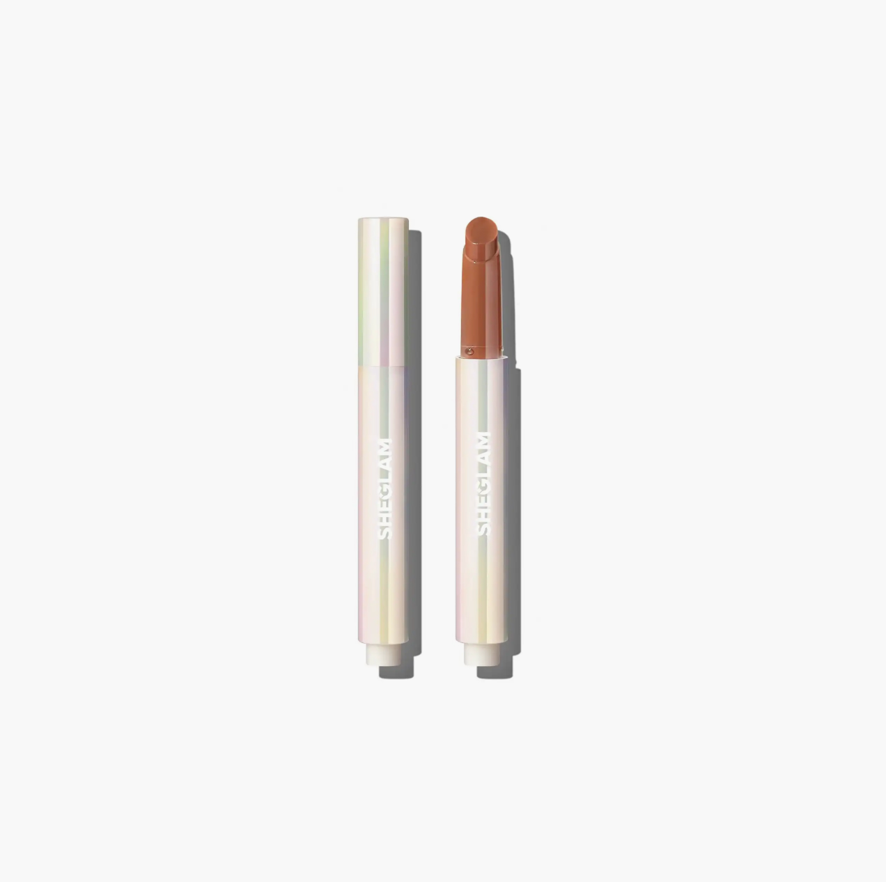 Sheglam Lip Plumper Pout-Perfect Shine offering glossy, plump lips with rich color payoff and hydration from coconut and grape seed oil for smooth comfort.